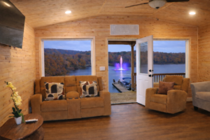 The Lumberjack Cabin with lake view, porch, fountain, and pontoon boat